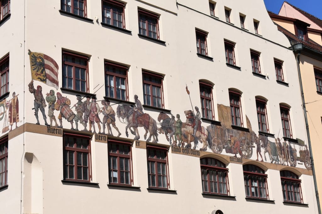 medieval mural on side of white building in Nuremberg