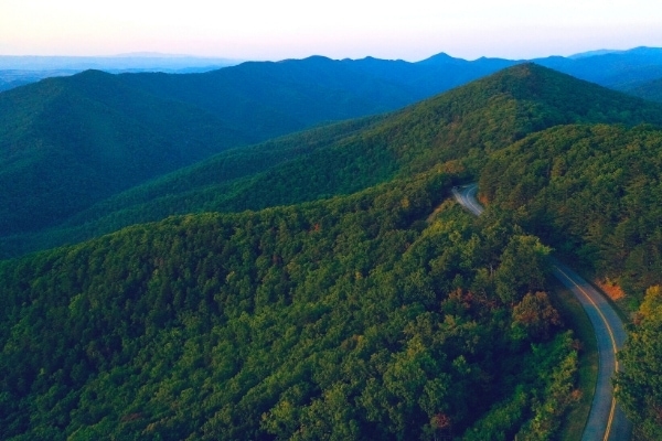 Blue Ridge Parkway winds through the green forests of the Blue Ridge Mountains