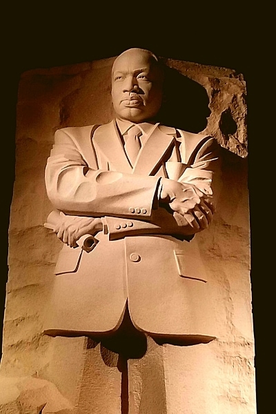 Martin Luther King Jr Memorial cut out of stone stares across the Tidal Basin of Washington, DC