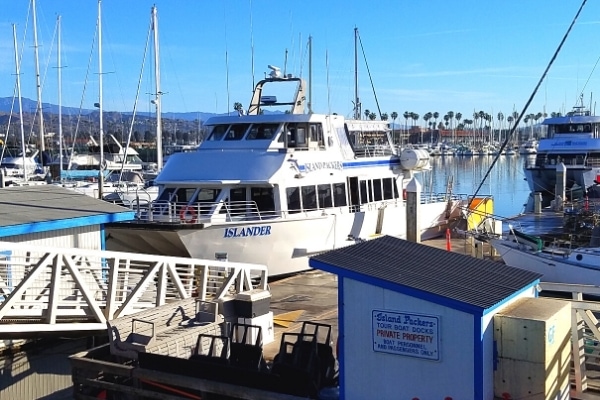 The white and blue Island Packers double deck ferry boat docked in the Ventura marina