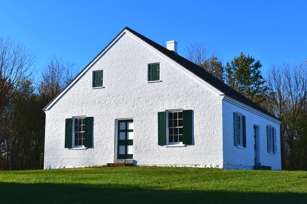 Restored and with a fresh coat of white paint the plain Dunker Church at Antietam Battlefield sits in the West Wood