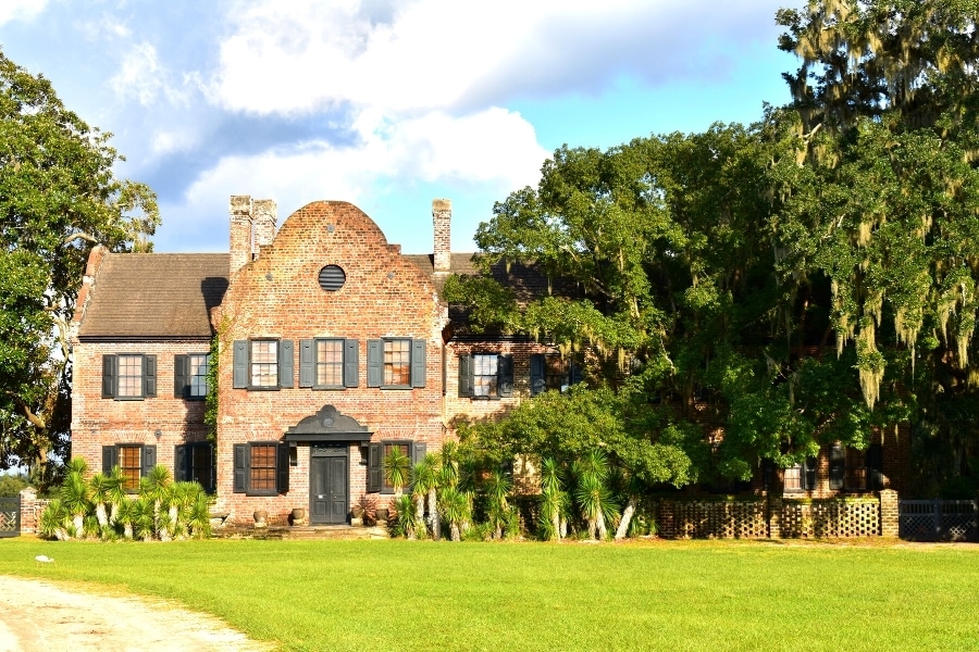 Old brick colonial period home surrounded by oak trees on the Middleton Plantation