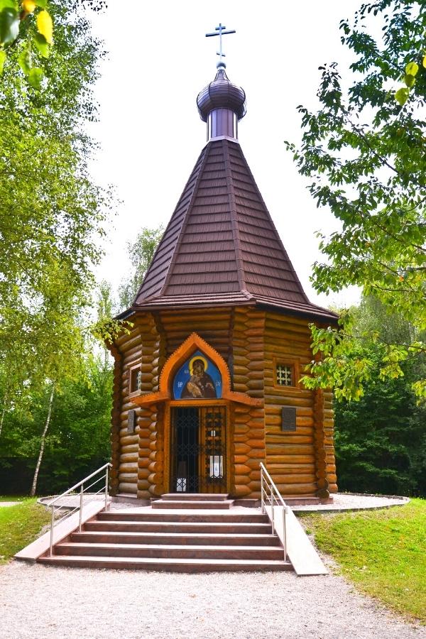A small wooden hexagonal building, a Russian Orthodox Church memorial site at the Dachau Concentration Camp Memorial Site