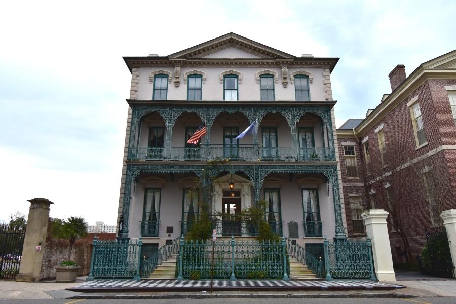 The John Rutledge House Inn features a marble front sidewalk, twin entry staircases and balconies lined with green wrought iron scrollwork