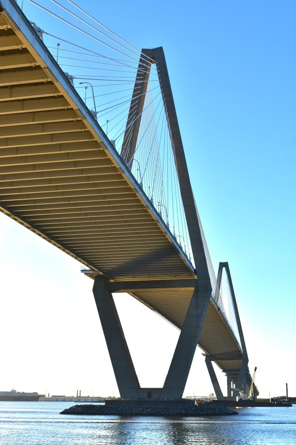 Geometric shapes and cable stays of the Arthur Ravenel Bridge as seen from below at the end of the Mt Pleasant Pier