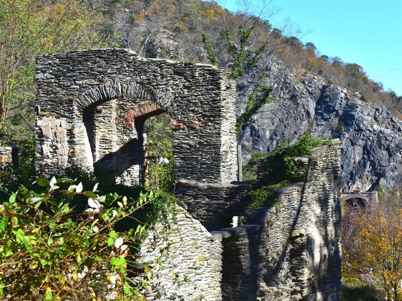 Stone ruins of a church are slowly being taken back by nature on a hillside in Harpers Ferry WV