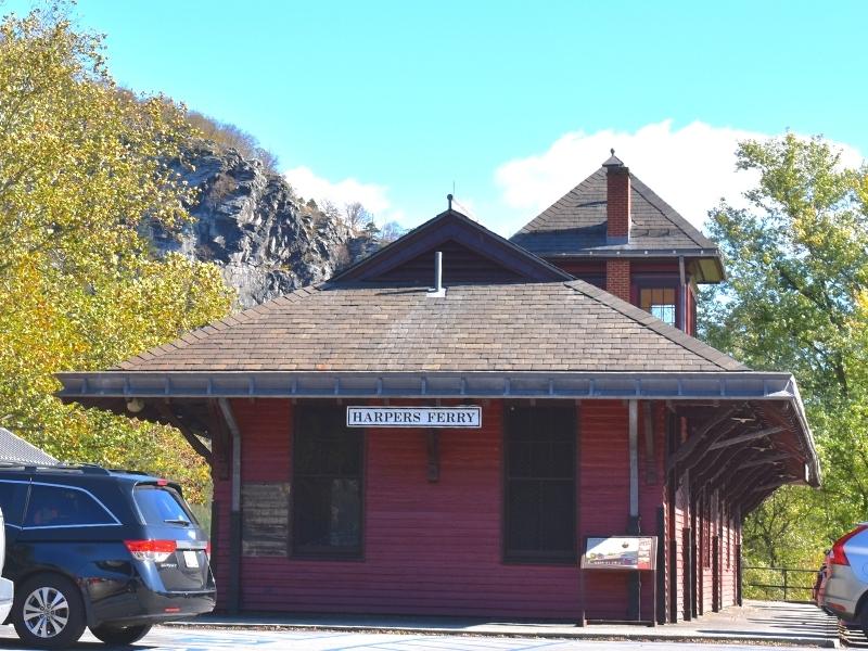 The red siding of the Harpers Ferry train station stands on its original spot, still serving Amtrak trains today