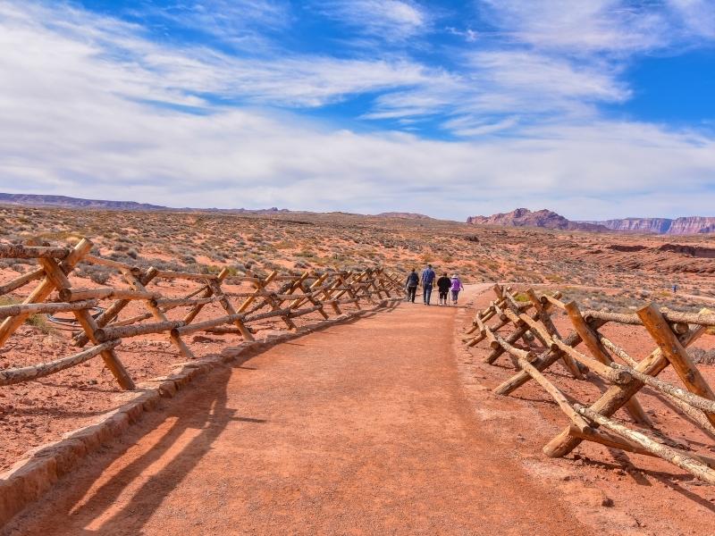 Wooden fencing keeps visitors on the path through the desert to Horseshoe Bend Overlook