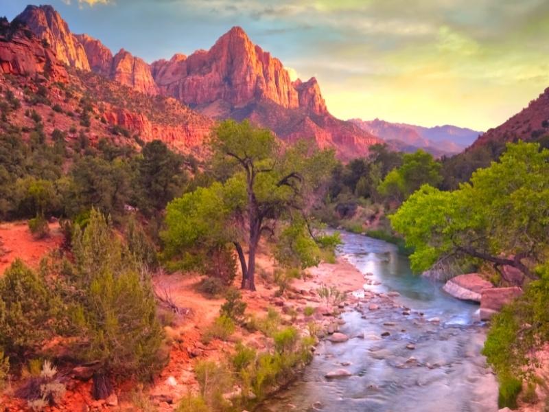 The Virgin River runs through Springdale, Utah as the canyons of Zion National Park give way to open hills.