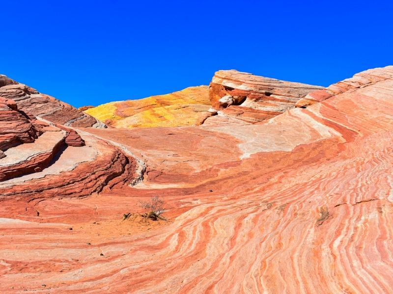 The rock formation at Valley of Fire State Park known as the Fire Wave for its many alternating stripes of orange that seem to swirl along the rocks