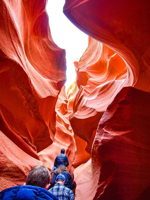 Lower Antelope Canyon is wider at the top and narrow at the bottom, so visitors walk single file