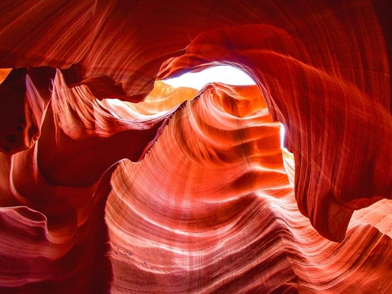 The orange walls swirl in curving patterns in Lower Antelope Canyon