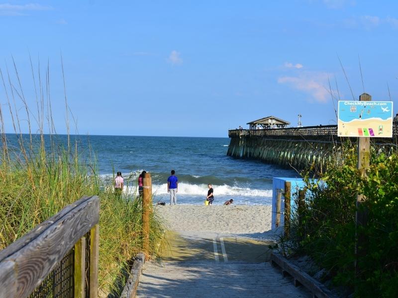 The Myrtle Beach State Park fishing pier as seen from a beach accessway