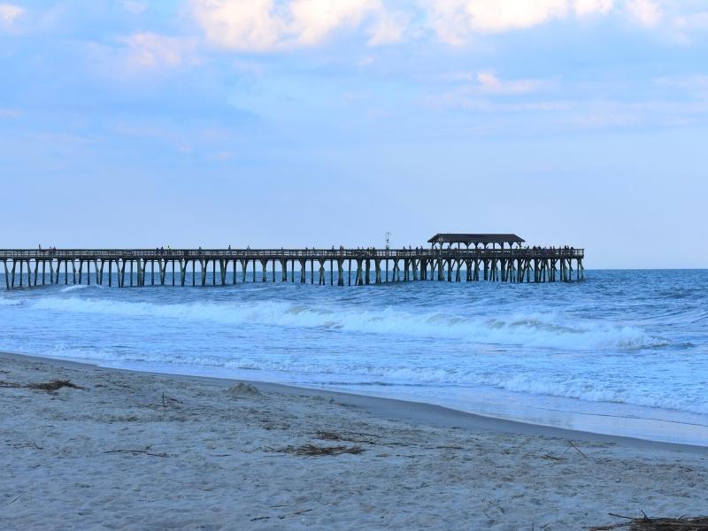 The Myrtle Beach State Park fishing pier extends into the ocean from the beach