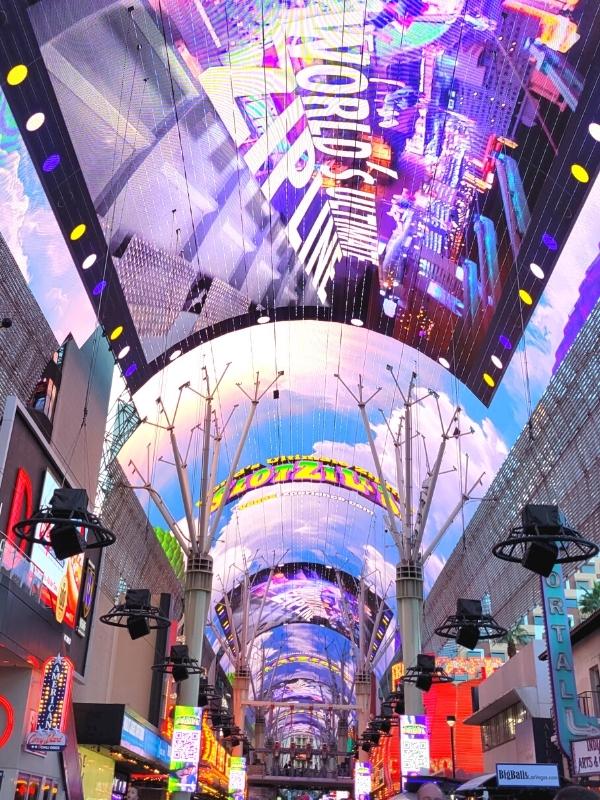 The LED screen ceiling of Fremont Street in downtown Las Vegas glows with an ad for the zipline