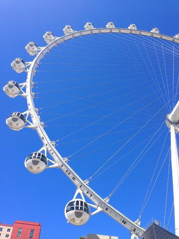 A portion of the LINQ Observation Wheel viewed against a blue sky