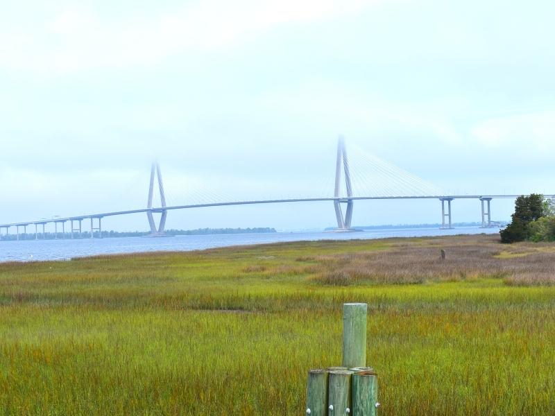The Arthur Ravenel bridge is partially obscured by morning mist, as seen from Patriot's Point near Charleston, SC