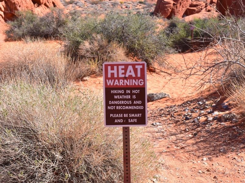 A heat warning sign reminds hikers to be smart and safe before entering this desert area in Valley of Fire State Park