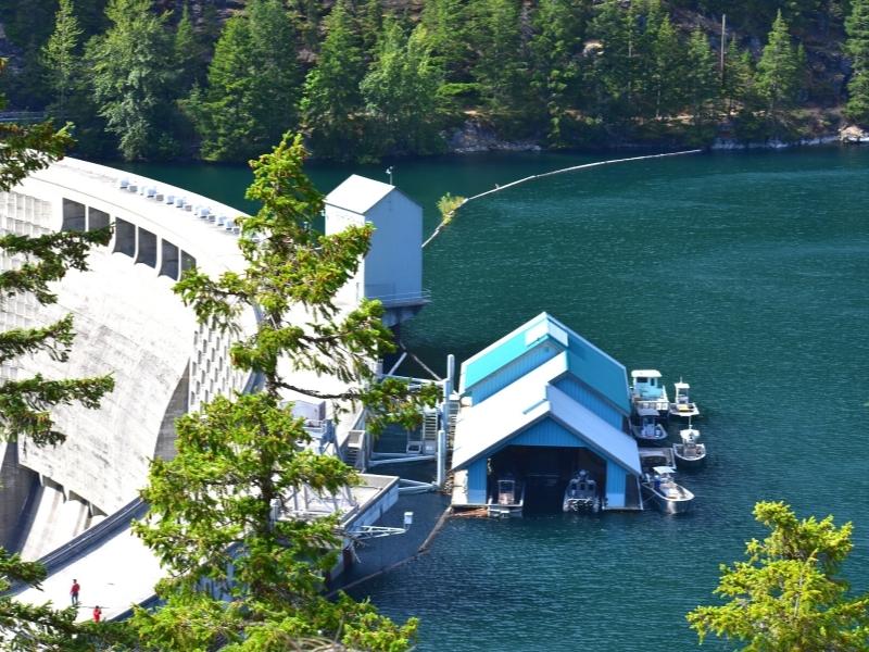 A boat house anchored on the backside of the dam at Ross Lake in North Cascades National Park