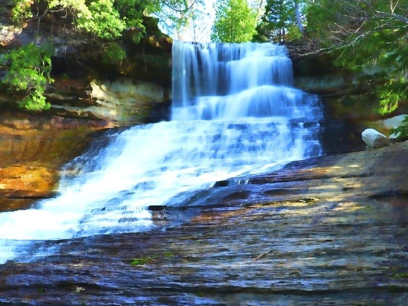 Close up view of the top of Laughing Whitefish Falls as it drops down a long incline near Pictured Rocks