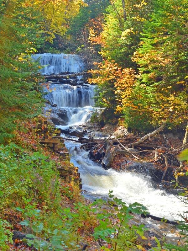 Sable Falls tumbles down multiple tiers as it makes it way from forested cliff to Lake Superior.
