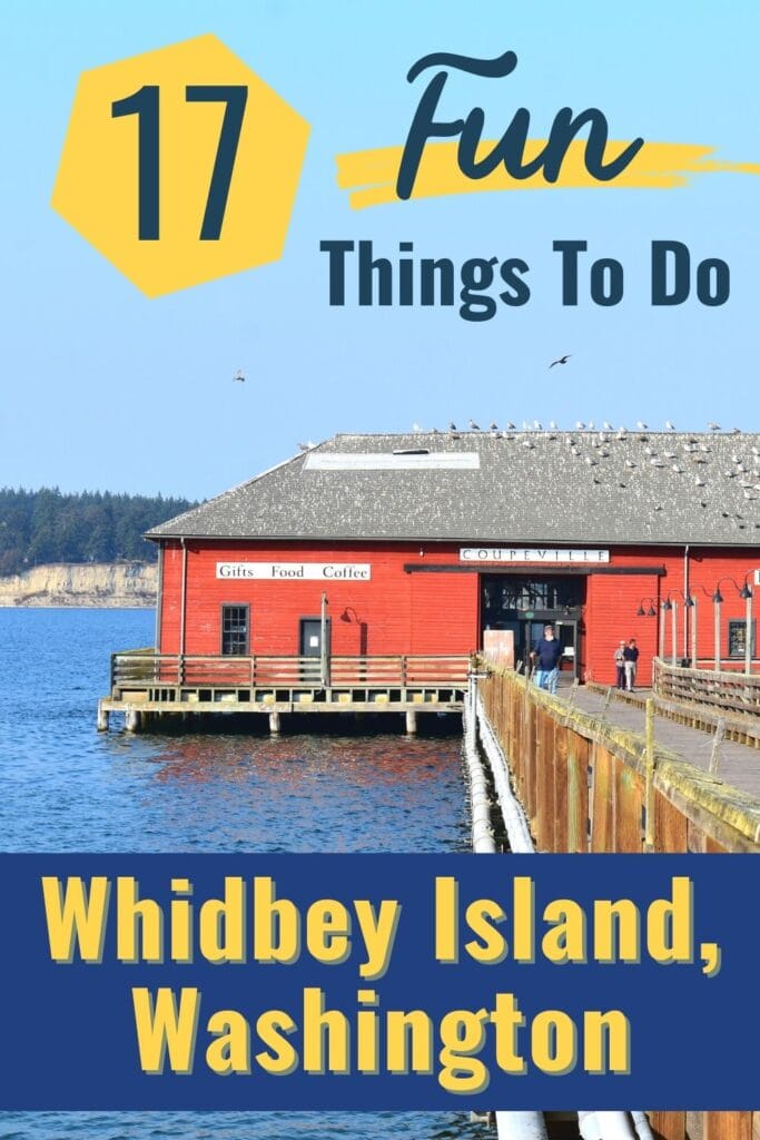 A red wharf building sits in the blue waters off Whidbey Island, WA with text 17 Fun Things to Do on Whidbey Island, Washington