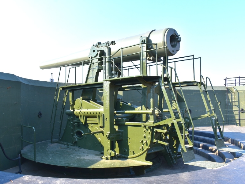 A disarmed disappearing gun carriage shows how Fort Casey worked before becoming obsolete