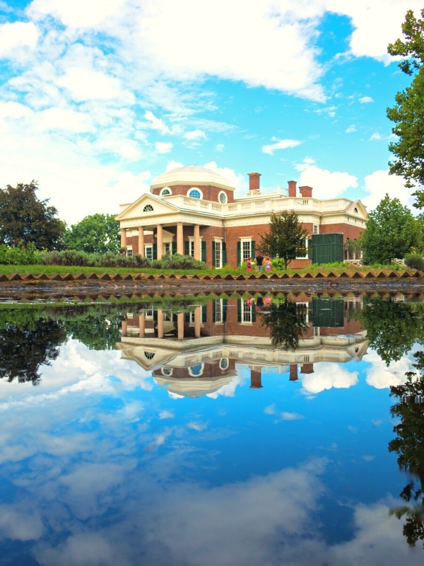 The back facade of Monticello, Thomas Jefferson's Virginia home, reflected in the pond