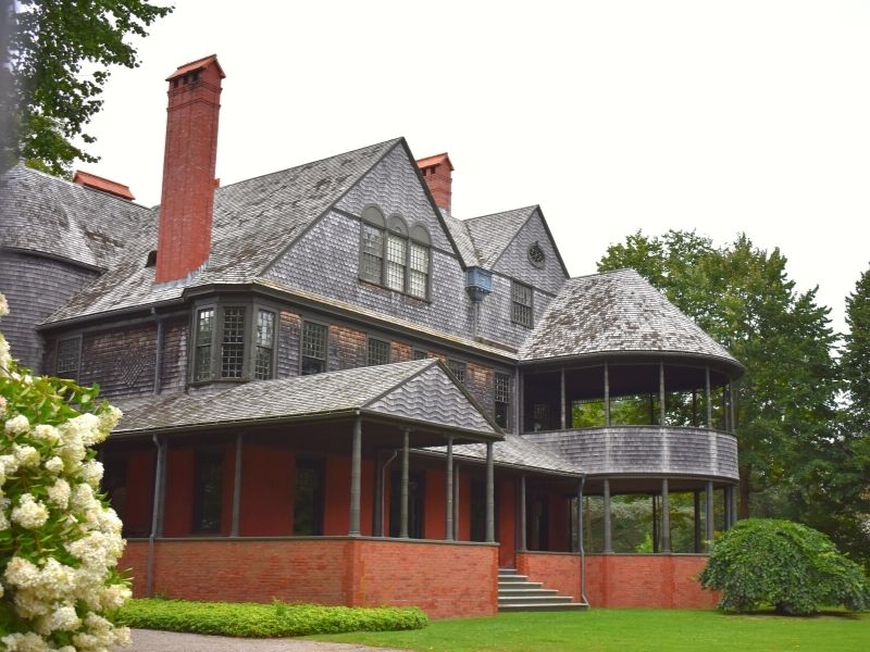 The Isaac Bell House with blooming hydrangeas in August in Newport, RI