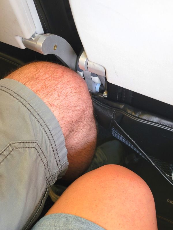 Comparing knee room in the Nice (Base Economy) fare on a Breeze Airways flight